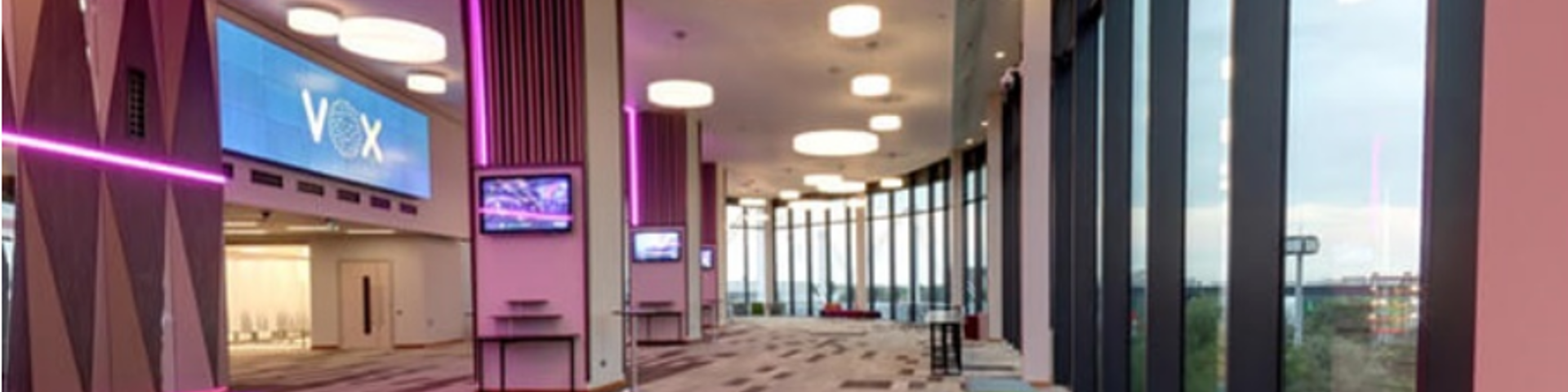 interior of the Vox, modern building, large windows, pink light