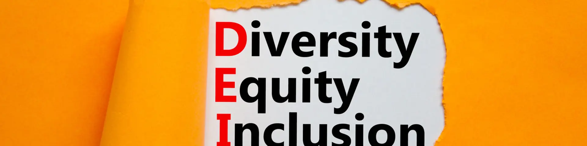 Words DEI, diversity, equity, inclusion appearing behind torn orange paper