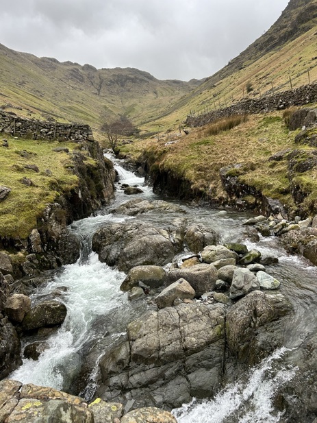 a stream and a cloudy sky